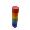 7-Layer chakra pillar candle with seven stacked colour bands – red, orange, yellow, green, blue, indigo and violet – standing upright on a neutral background.