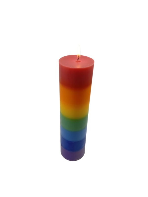 7-Layer chakra pillar candle with seven stacked colour bands – red, orange, yellow, green, blue, indigo and violet – standing upright on a neutral background.